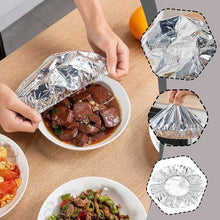 Load image into Gallery viewer, Person using reusable aluminum foil insulation cover on a bowl of food to keep it hot and fresh.