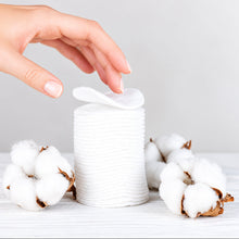 Load image into Gallery viewer, Makeup Remover Cotton Pads - 120 Pcs stacked with hand, surrounded by cotton plants on a wooden surface.