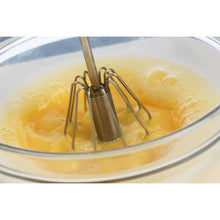 Load image into Gallery viewer, 1 Pc Semi-Automatic Egg & Cappuccino Beater (27x5cm) | Hand-Push Rotary Whisk & Milk Frother mixing eggs in a glass bowl.