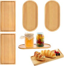 Load image into Gallery viewer, Set of wooden trays in various shapes with food items on a white background