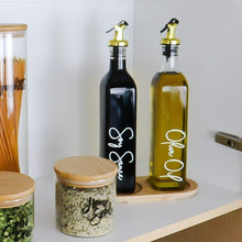 تحميل الصورة في عارض المعرض، Set of olive oil and vinegar bottles with wooden containers on a kitchen shelf.