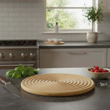 Load image into Gallery viewer, Wooden cutting board on a kitchen counter with a knife, basil, and tomatoes.