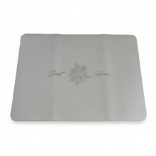 Load image into Gallery viewer, A white rectangular mouse pad with rounded corners, featuring a delicate gold floral design and elegant cursive text, displayed on a wooden desk.