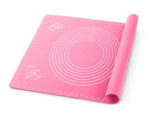 Load image into Gallery viewer, Pink silicone baking mat with measuring scale and circular dough guide for easy pastry preparation.