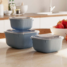 تحميل الصورة في عارض المعرض، Set of three gray food containers with lids on a kitchen counter.