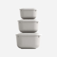Load image into Gallery viewer, Set of three gray storage containers with lids on a white background