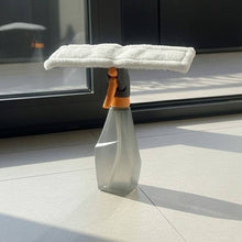 Load image into Gallery viewer, Cleaning tool with a spray nozzle on a tiled floor in front of a glass door.