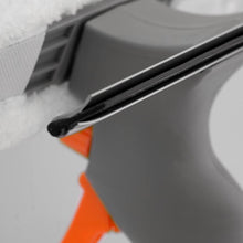 Load image into Gallery viewer, Close-up of a car's windshield wiper on a snowy day