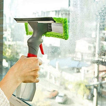 Load image into Gallery viewer, Person cleaning a window with a squeegee and spray bottle