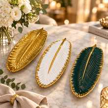 Load image into Gallery viewer, Three decorative plates shaped like feathers on a white background