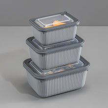 تحميل الصورة في عارض المعرض، Set of three gray food storage containers with lids on a gray background