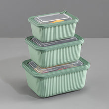 تحميل الصورة في عارض المعرض، Set of three green food storage containers with clear lids on a gray background