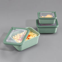 تحميل الصورة في عارض المعرض، Set of green food storage containers with lids on a gray background