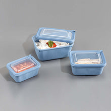تحميل الصورة في عارض المعرض، Three blue food storage containers with lids on a gray background