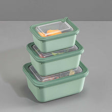 Load image into Gallery viewer, Set of three green food storage containers with clear lids on a gray background