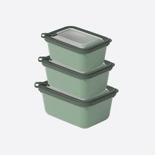 تحميل الصورة في عارض المعرض، Set of three green food storage containers with black lids on a white background