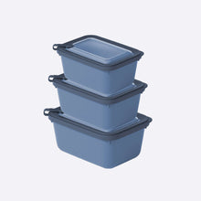Load image into Gallery viewer, Set of three blue storage containers with black lids on a white background
