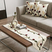 Load image into Gallery viewer, Linen handmade table runner and cushion set featuring floral embroidery on a coffee table and sofa.