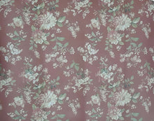 Load image into Gallery viewer, Floral patterned mat with green and white flowers on a pinkish-brown background