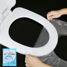 تحميل الصورة في عارض المعرض، Person using a black toilet seat cover with a blue packaging on a black background