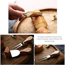 Load image into Gallery viewer, Cheese knife set with wooden handles slicing cheese on wooden board, featuring spade and fork knives.