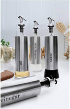 تحميل الصورة في عارض المعرض، Stainless steel oil and vinegar dispensers with sleek design, showcasing labels for oil, cooking wine, and sauce.