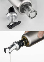 Load image into Gallery viewer, Glass control pot with stainless steel lid and pouring spout for oil and vinegar, featuring a non-drip design.