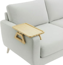 Load image into Gallery viewer, bamboo sofa armrest tray positioned on a light gray sofa, ideal for drinks, snacks, and remote controls