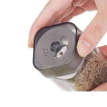 Load image into Gallery viewer, Close-up of a Plastic lid on a shaker, part of Shakers - Glass Spice seasoning jars Set of 6 with Plastic Lids & Holder.