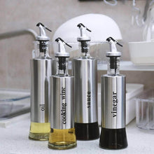 تحميل الصورة في عارض المعرض، Stainless steel olive oil and vinegar dispensers with labels for cooking wine, sauce, oil, and vinegar.