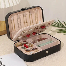 Load image into Gallery viewer, Leather portable travel jewelry box with multiple compartments for earrings, necklaces, and rings, neatly organized.