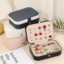 Load image into Gallery viewer, Multi-layer leather travel jewelry box with earrings, rings, and necklace storage compartments.