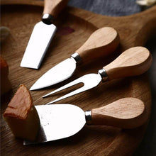 Load image into Gallery viewer, Cheese knives set with wooden handles on a cutting board, perfect for slicing and serving various cheeses.