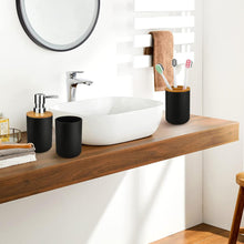 تحميل الصورة في عارض المعرض، Bathroom vanity with white sink, wooden shelf, and bathroom accessories.