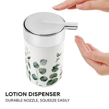 Load image into Gallery viewer, Lotion dispenser with eucalyptus leaf design and a hand squeezing it, on a white background.