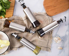 تحميل الصورة في عارض المعرض، Stainless steel oil and vinegar dispenser set with glass bottles on a marble countertop, ideal for cooking.