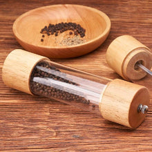 تحميل الصورة في عارض المعرض، Premium wooden pepper grinder with transparent acrylic mill and wooden bowl containing spices.