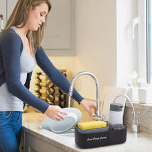 تحميل الصورة في عارض المعرض، Woman using a 3 in 1 soap dispenser with sponge holder at kitchen sink for easy dish washing.