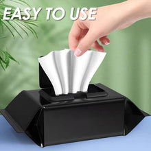 تحميل الصورة في عارض المعرض، Hand pulling out a wipe from a black container, showcasing easy-to-use shoe cleaning wipes.