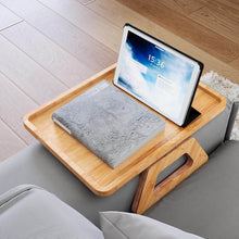 Load image into Gallery viewer, Bamboo sofa armrest tray featuring a tablet and a book on a gray couch, designed for convenience and style.