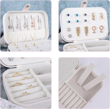Load image into Gallery viewer, Leather portable travel jewelry box with multi-layer storage for earrings, necklaces, and rings in a white design.