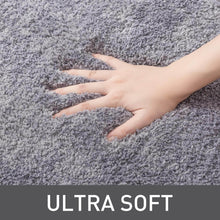 تحميل الصورة في عارض المعرض، Hand touching ultra-soft gray carpet with 'ULTRA SOFT' text below.