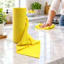 Load image into Gallery viewer, A roll of bright yellow microfiber cleaning towels, with one towel unrolled and draped in front, set against a plain white background.
