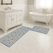 تحميل الصورة في عارض المعرض، Bathroom with floral-patterned rugs on the floor, vanity, and bathtub.