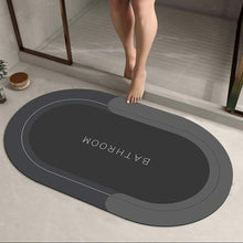 تحميل الصورة في عارض المعرض، Gray bath mat with 'Bathroom' text on a bathroom floor.