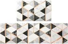 Load image into Gallery viewer, Set of geometric-patterned coasters with gold accents on a white background
