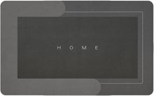 Load image into Gallery viewer, Black doormat with 'HOME' text on a gray background