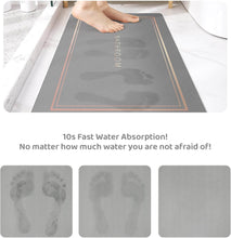 Load image into Gallery viewer, Gray bath mat with footprints and text on a white background