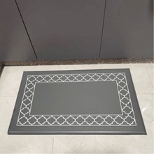 Load image into Gallery viewer, A gray PVC kitchen mat with a geometric pattern around the border, placed on a kitchen floor.