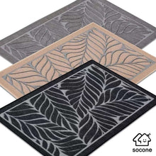 تحميل الصورة في عارض المعرض، Three leaf-patterned doormats in gray, beige, and black with a Soconex logo.